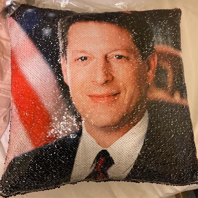 Qstomize.com - Personalize Your Pillow with Custom Reversible Sequin Design Beaded pixel art pillow featuring a professional man against a patriotic red, white, and blue background.